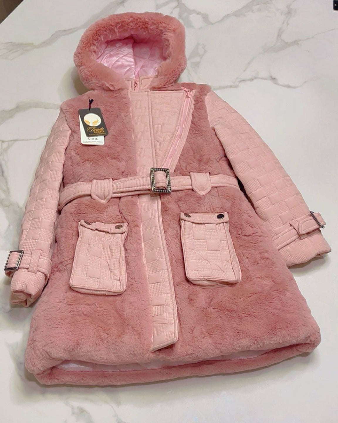 Flat-lay view of the Isabella girls' rose pink faux fur coat with a plush hood, signature quilted sleeves, and a polished silver rectangular buckle belt.
