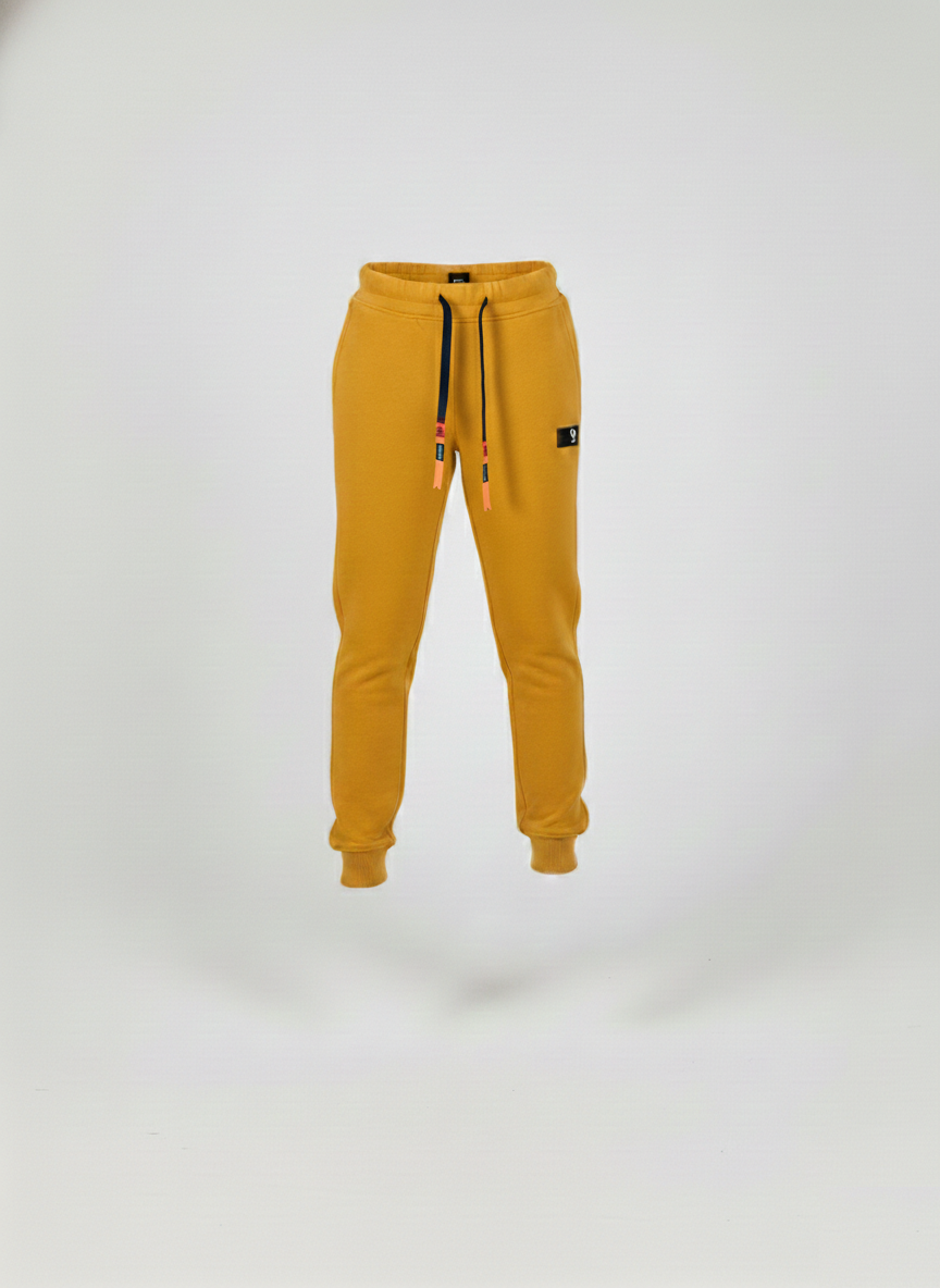 High-quality mustard yellow kids' joggers with black drawstrings and soft-on-skin fabric; available for local pickup at 533 Sydney Rd, Brunswick.