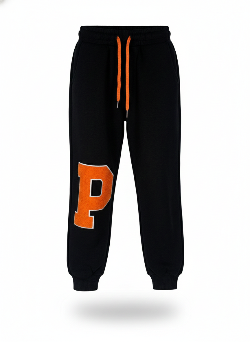 Boys' black summer jogger pants featuring a bold orange 'P' graphic and matching drawstring, designed for a comfortable sport-to-night fit from Trendy Angels Boutique Melbourne.