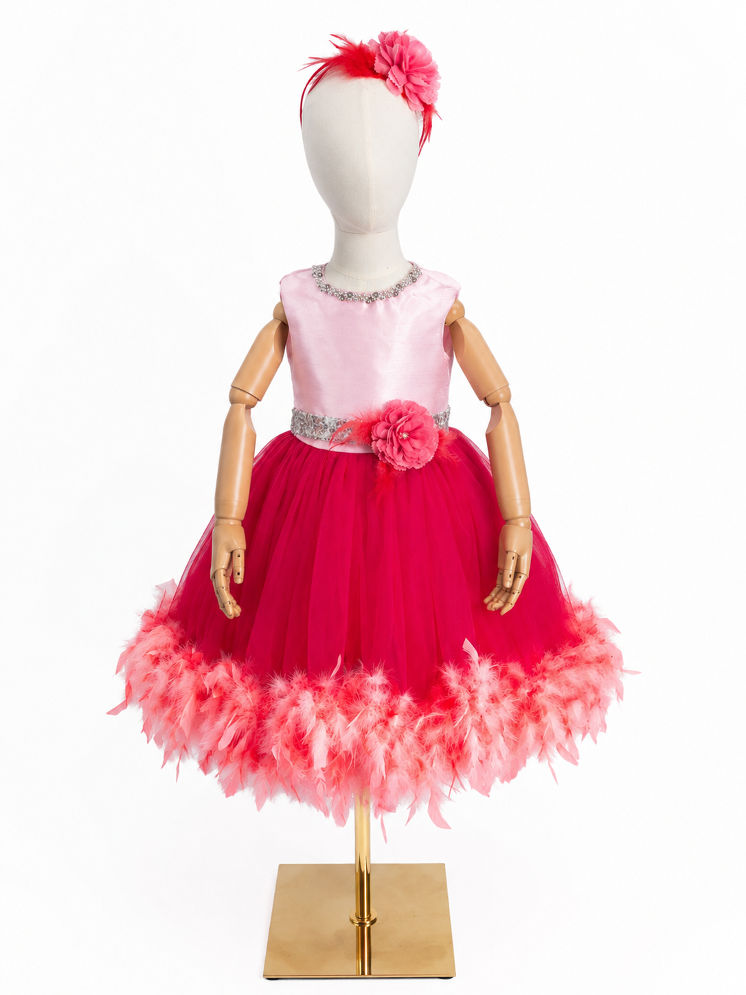 Girls pink and red princess dress with feather trimmed tulle skirt on mannequin front view