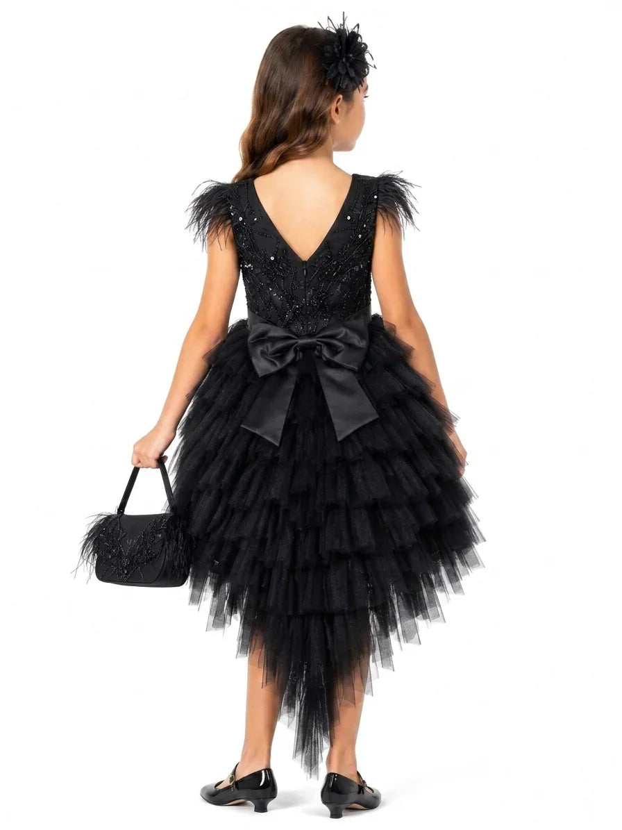 Rear view of the Luxury Black Feather Flower Girl Dress featuring a voluminous tiered tail and satin bow, serving families in Keysborough and the City of Casey.