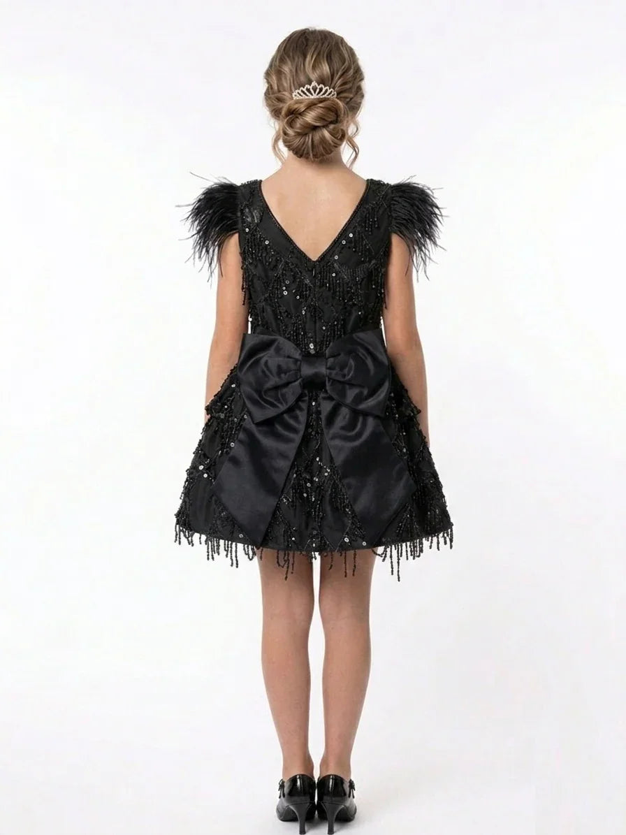 Rear view of the Luxury Black Feather Flower Girl Dress showing the oversized satin bow and sequin details, popular for boutique weddings in Keysborough and the City of Greater Dandenong.