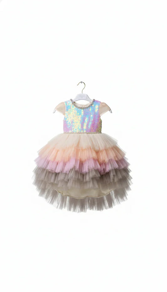 Front-facing view of a premium celebration dress featuring an iridescent sequined bodice and a multi-layered pastel ombré tulle skirt. Highlighted by a sparkling crystal belt at the waist and elegant crystal neckline. Showcased at our physical boutique located at 533 Sydney Rd, Brunswick, Melbourne. Phone: 04 19 19 19 09.