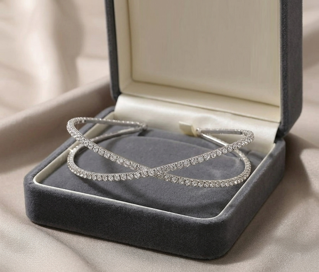 Luxury girls crystal cross headband presented in a premium grey velvet gift box