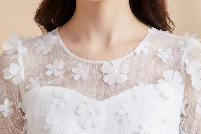 showing the round neck of the dress 