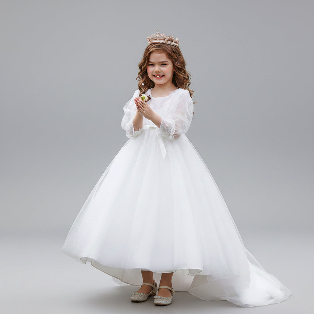 Young girl wearing a white V-neck princess dress with bubble sleeves, pearl-beaded waist, and tiara, perfect for formal occasions in Brunswick.